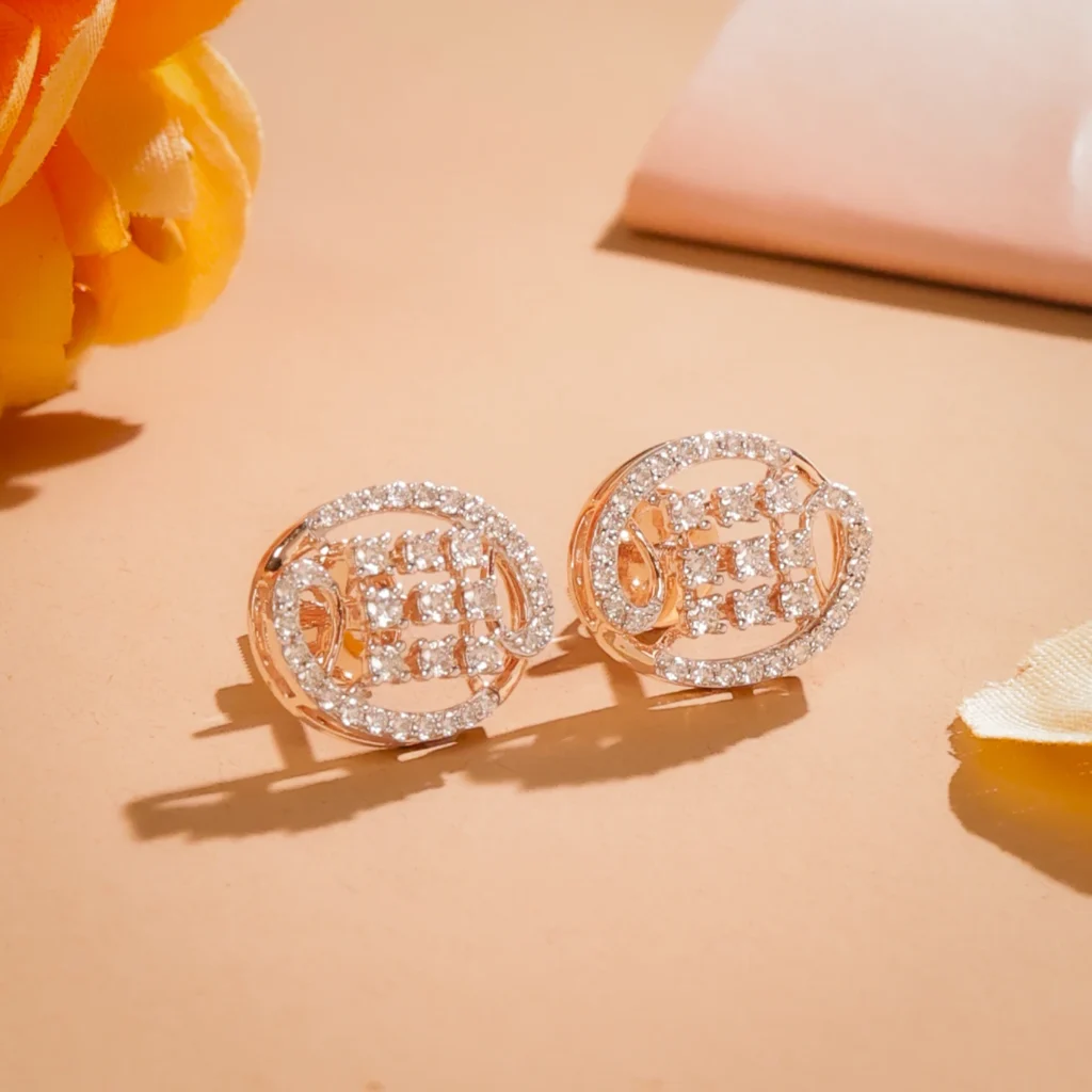 Rose gold oval stud earrings with pavé diamond halo and geometric bar design, displayed on peach background with marigold flowers