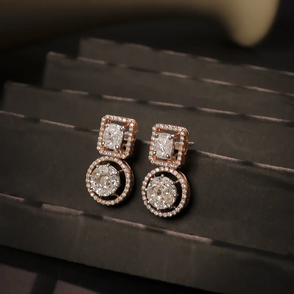 Rose gold diamond stud earrings product shot on red background