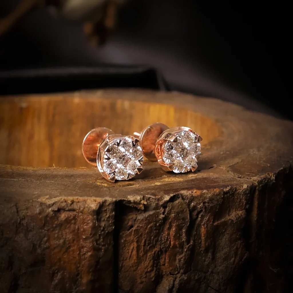 Diamond teardrop earrings on rustic wood background