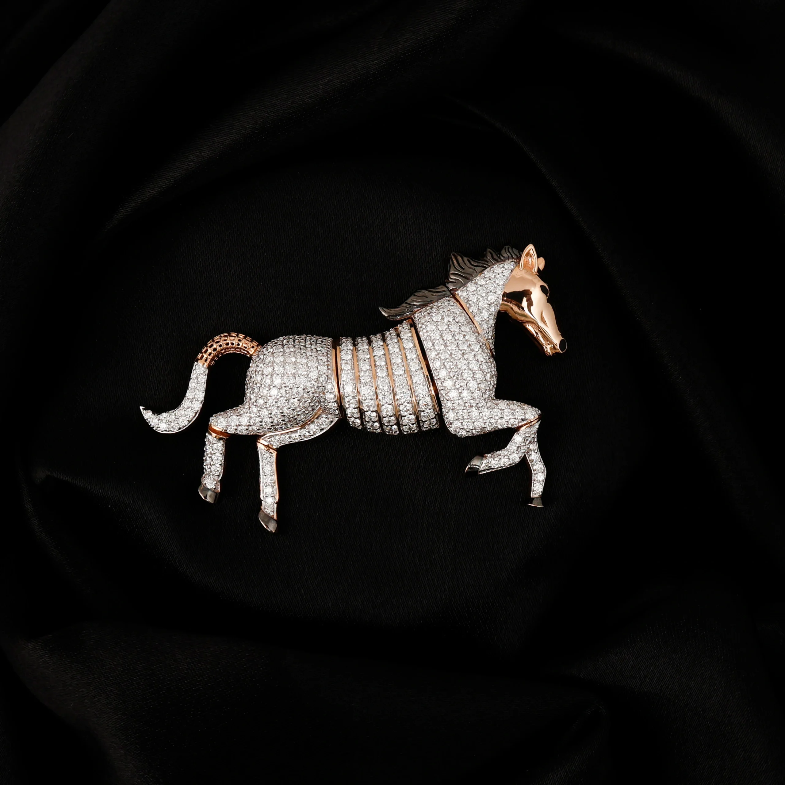 Diamond horse brooch on black background