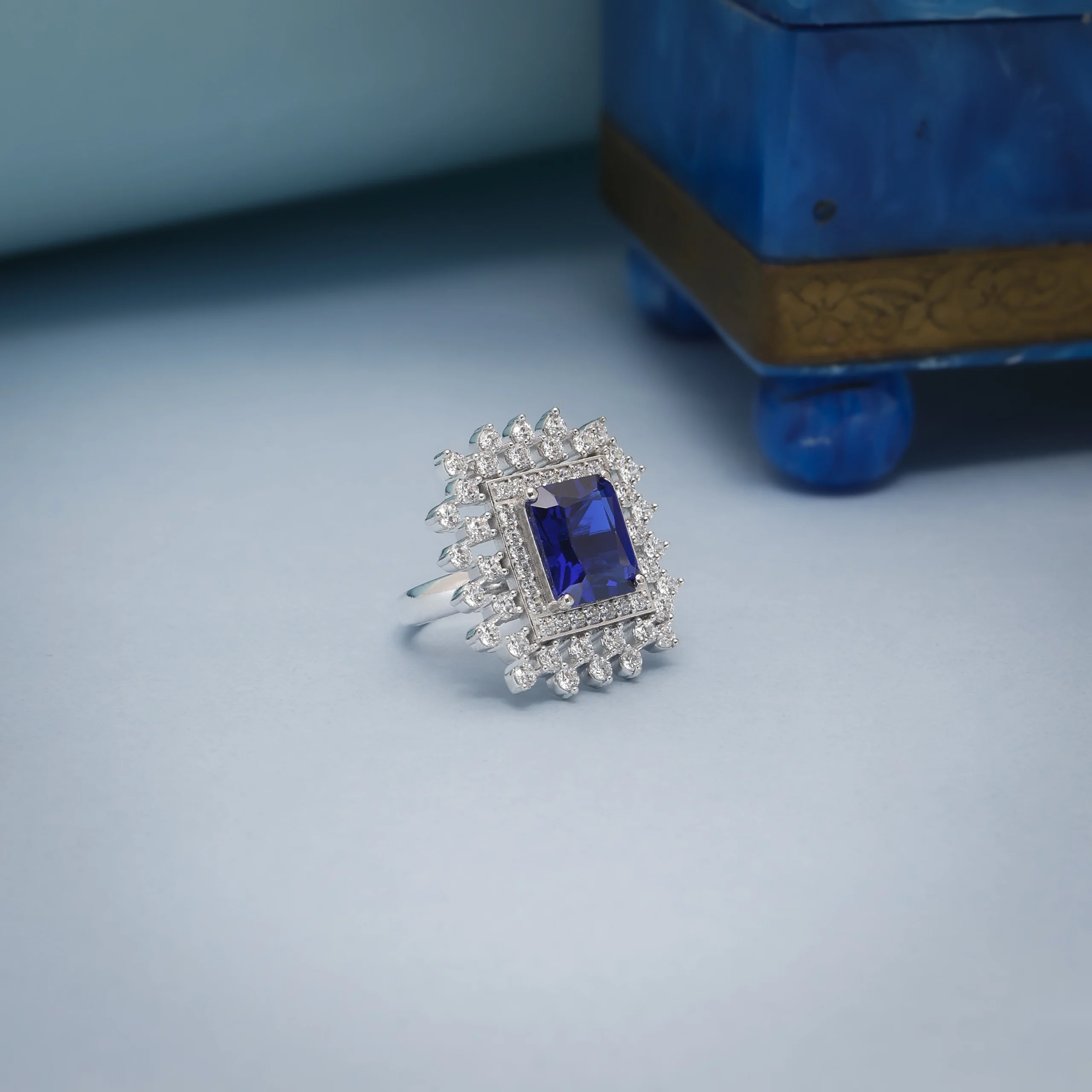 Silver jewellery photography studio showcasing a blue sapphire diamond ring