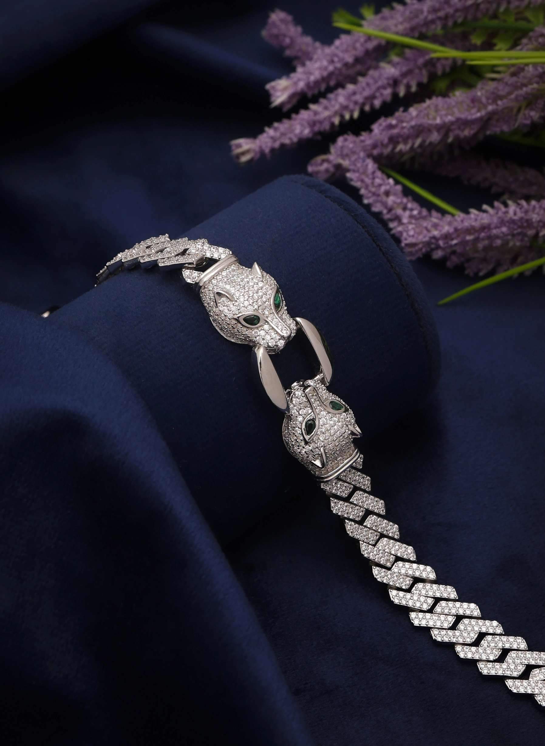 Silver jewellery photography studio showcasing a diamond panther bracelet with red gemstone eyes