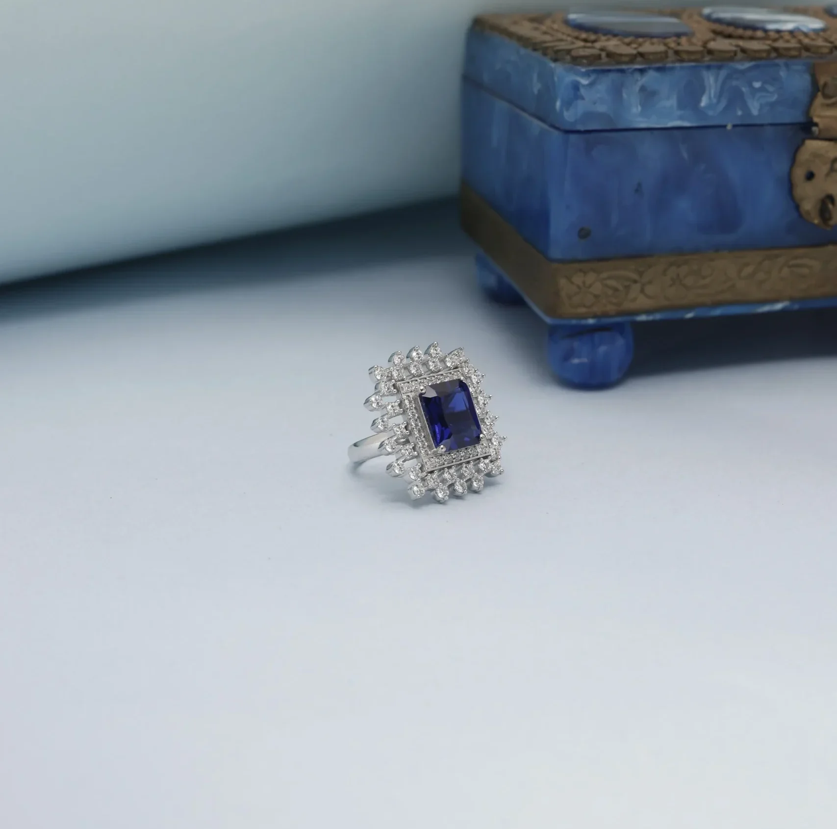 Silver ring photoshoot raw image Blue sapphire silver ring photographed in a professional jewellery photography studio