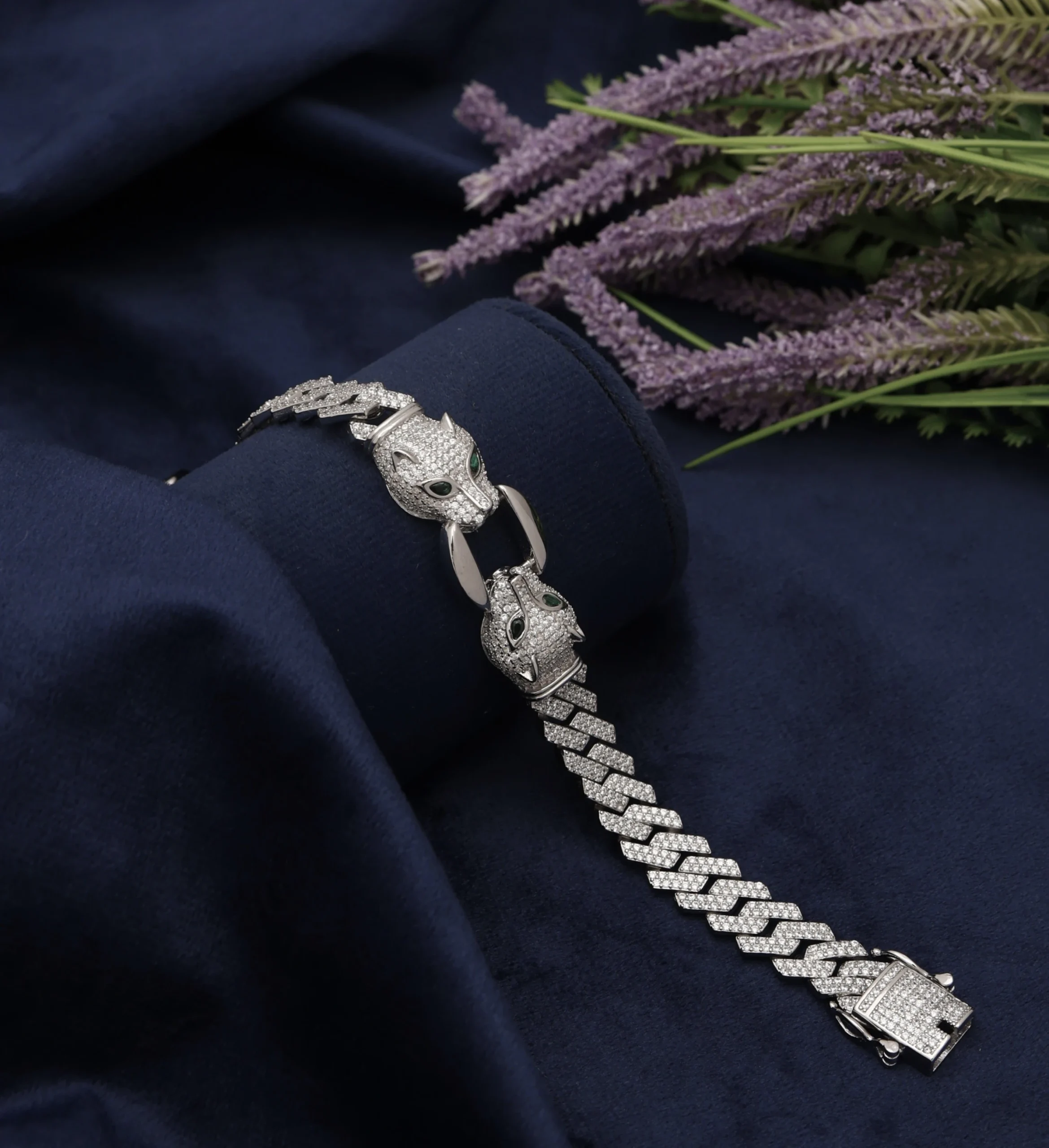 Silver Bracelet raw image Diamond panther bracelet in silver photographed on dark blue fabric